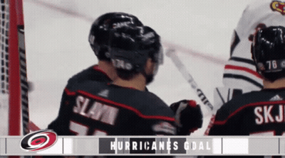 A Hockey Game Between The Hurricanes And Blackhawks GIF
