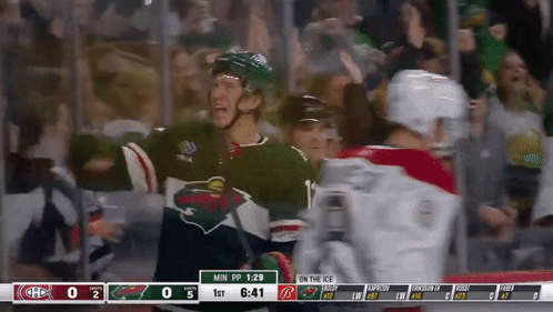 A Hockey Game Between The Minnesota Wild And The Montreal Canadiens Is Being Played GIF