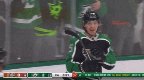 A Hockey Game Is Being Played Between The Stars And The Hawks GIF