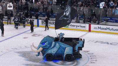 A Hockey Game Is Being Played In A Stadium Sponsored By Massmutual Enterprise And Delta GIF