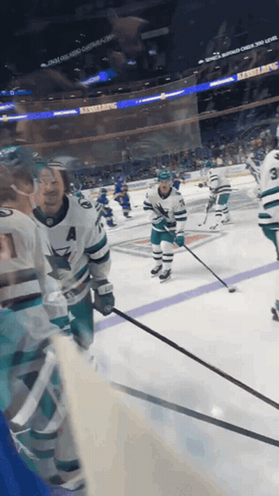 A Hockey Game Is Being Played In A Stadium That Has A Banner That Says ' Reebok ' On It GIF