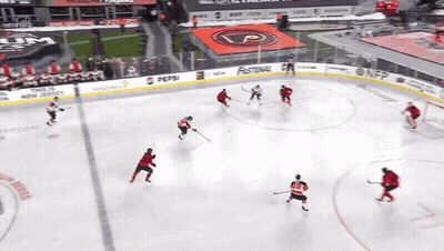 A Hockey Game Is Being Played In A Stadium With A Pepsi Ad GIF