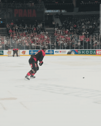 A Hockey Game Is Being Played In A Stadium With A Sign That Says ' Allianz ' On It GIF