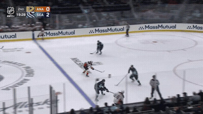 A Hockey Game Is Being Played In A Stadium With Ads For Massmutual On The Ice GIF
