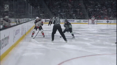 A Hockey Game Is Being Played In A Stadium With Advertisements For Amazon And Boeing GIF