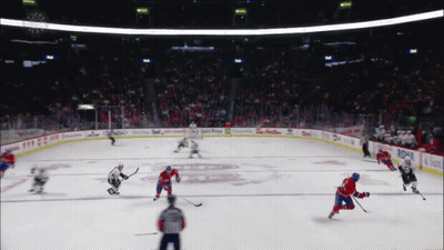 A Hockey Game Is Being Played In A Stadium With Advertisements For Tim Hortons And Budweiser GIF