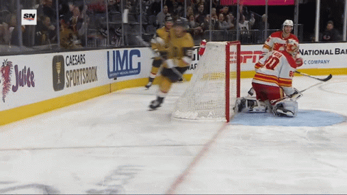 A Hockey Game Is Being Played In Front Of A Banner For Caesars Sportsbook GIF