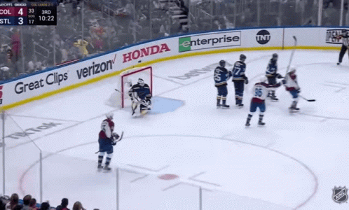 A Hockey Game Is Being Played In Front Of A Banner That Says Great Clips Verizon And Honda GIF