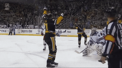 A Hockey Game Is Being Played In Front Of A Banner That Says Jagermeister GIF