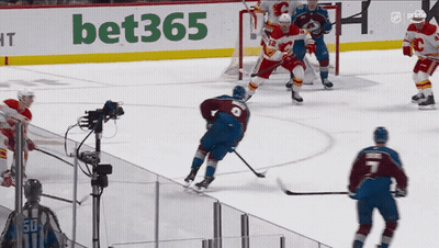 A Hockey Game Is Being Played In Front Of A Bet365 Sign GIF