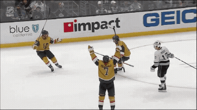 A Hockey Game Is Being Played In Front Of A Blue California Advertisement GIF