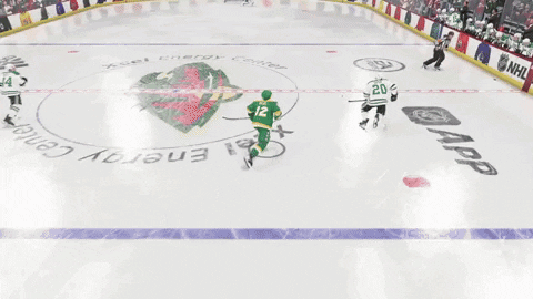 A Hockey Game Is Being Played In Front Of A Crowd And A Banner That Says Nflshop.com GIF