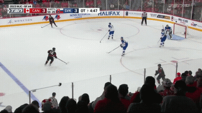 A Hockey Game Is Being Played In Front Of A Crowd With Ads For Halifax Nova Scotia And Moncton GIF