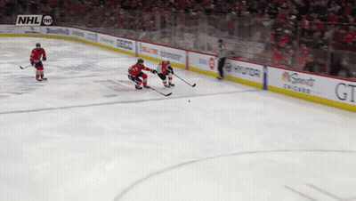 A Hockey Game Is Being Played In Front Of A Crowd With Nhl On The Screen GIF