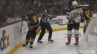 A Hockey Game Is Being Played In Front Of A Fedex Sign GIF