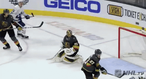 A Hockey Game Is Being Played In Front Of A Geico Sign GIF