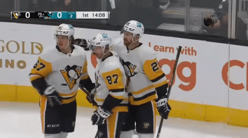 A Hockey Game Is Being Played In Front Of A Gold Casino Sign GIF