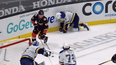 A Hockey Game Is Being Played In Front Of A Honda Advertisement GIF
