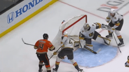 A Hockey Game Is Being Played In Front Of A Honda Sign GIF