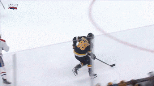A Hockey Game Is Being Played In Front Of A Jetblue Sign GIF