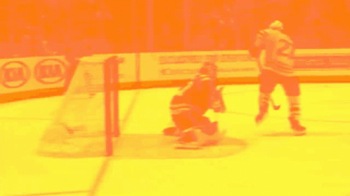 A Hockey Game Is Being Played In Front Of A Kia Ad GIF