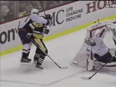 A Hockey Game Is Being Played In Front Of A Life Changing Medicine Sign GIF