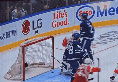 A Hockey Game Is Being Played In Front Of A Life 'S Good Banner GIF