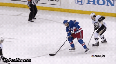 A Hockey Game Is Being Played In Front Of A Nbc Advertisement GIF