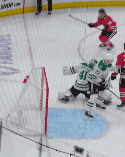 A Hockey Game Is Being Played In Front Of A Netmaster Banner GIF