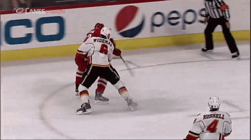 A Hockey Game Is Being Played In Front Of A Pepsi Advertisement GIF