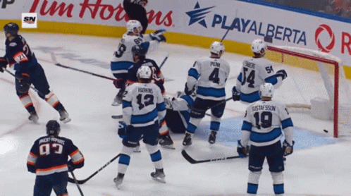 A Hockey Game Is Being Played In Front Of A Playalberta Advertisement GIF