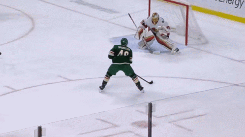 A Hockey Game Is Being Played In Front Of A Polaris Advertisement GIF