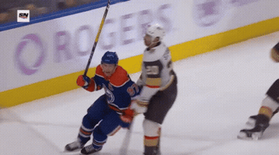 A Hockey Game Is Being Played In Front Of A Rogers Banner GIF
