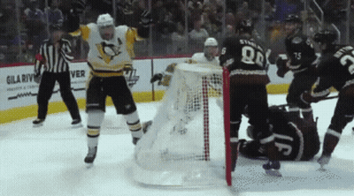 A Hockey Game Is Being Played In Front Of A Sign For Gila River GIF