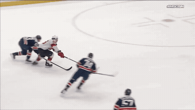 A Hockey Game Is Being Played In Front Of A Sign That Says Te-Syrup GIF