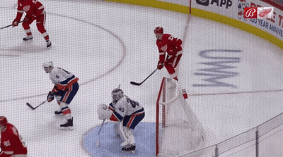 A Hockey Game Is Being Played In Front Of A Sign That Says Uvwm GIF