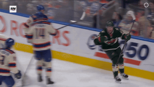 A Hockey Game Is Being Played In Front Of A Sn Logo GIF