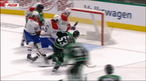 A Hockey Game Is Being Played In Front Of A Volkswagen Sign GIF
