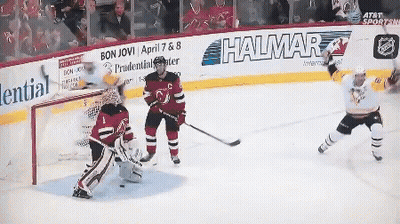 A Hockey Game Is Being Played In Front Of A Wall That Says Halmar GIF
