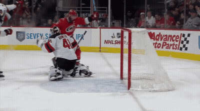A Hockey Game Is Being Played In Front Of An Ad For Advanced To Parts GIF