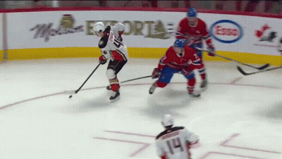 A Hockey Game Is Being Played In Front Of An Advertisement For Mcdonalds GIF