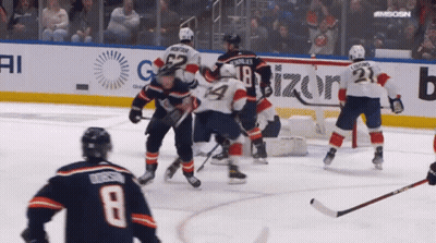 A Hockey Game Is Being Played In Front Of An Advertisement For Vizion GIF