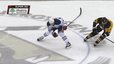 A Hockey Game Is Being Played In The Super-Mo GIF