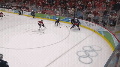 A Hockey Game Is Being Played In Vancouver In 2010 GIF