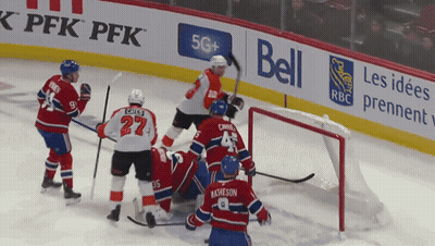 A Hockey Game Is Being Played On A Rink Sponsored By Bell And Rbc GIF