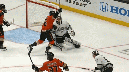 A Hockey Game Is Being Played On A Rink With A Honda Ad In The Background GIF