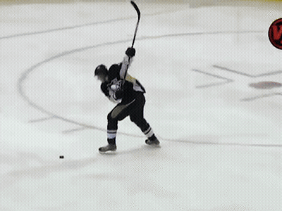 A Hockey Game Is Being Played On A Rink With Lumber Advertisements On The Walls GIF
