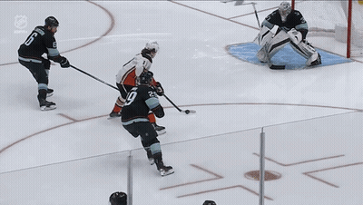 A Hockey Game Is Being Played On A Rink With The Word Son On The Ice GIF
