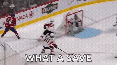 A Hockey Game Is Being Played On A Rink With The Words What A Save Written On The Ice GIF