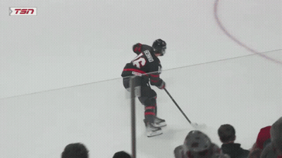 A Hockey Game Is Being Played With A Tsn Ad Behind The Goal GIF